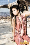 Seductive Asian Asako strips and shows her assets on the beach