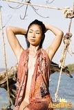 Seductive Asian Asako strips and shows her assets on the beach