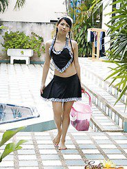 Pig-tailed petite Asian cutie washing her slim body outdoors